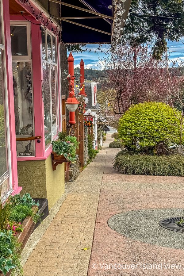 Colourful shop fronts lined down a hill in Ladysmith BC. - a great place on Vancouver Island to shop, eat and explore